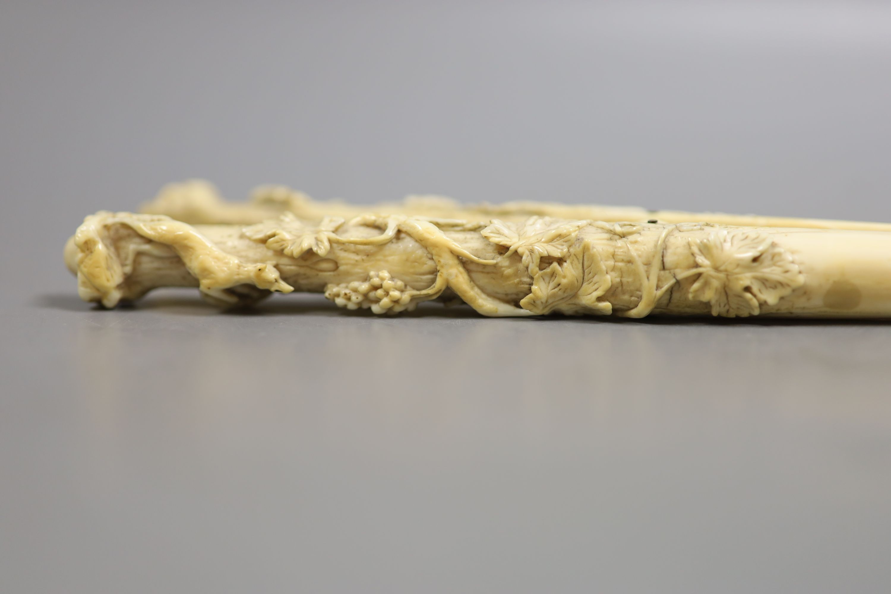 A pair of late 19th century carved ivory glove stretchers